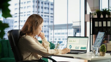 Ambitious female leader developing a strategic plan for business growth, aligning the company...