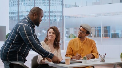 Real estate brokers meeting with client to reach an agreement for property leasing contract,...