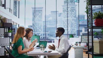 Job seeker presents his CV resume to HR recruiters during a corporate interview, discussing his past achievements and career aspirations. Employees looking for personnel with experience. Camera B.