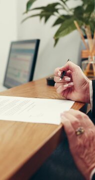 Signature, front desk and hands of woman in hotel for booking in, hospitality and register agreement. Receptionist, concierge and paperwork with person signing in lodge for admin and reservation