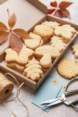 Autumn shaped cookies baking in cardboard gift box