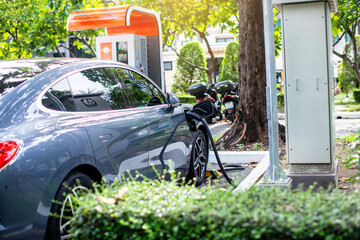 Selective focus to A modern electrical fast charger for the electrical or hybrid PHEV automobiles. An Energy power of future. Ecology friendly charger concept.