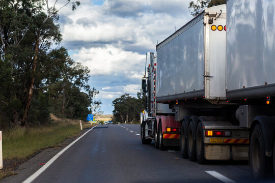 Hazard of dangerous overtaking move by truck on highway road in country