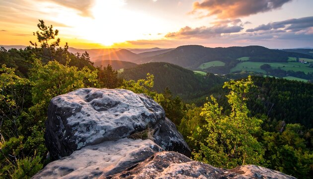 Scenic golden sunset over rolling green hills and rocky foreground