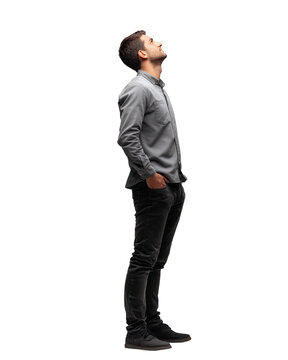 Young man in casual clothes looking up with confidence isolated