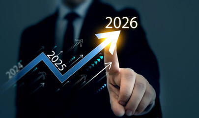 Businessman analyzing financial growth chart for 2026 year.Showing revenue increase, market trends, investment strategy, economic progress, success and future business development in 2026	