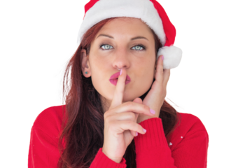 A woman wearing a festive red sweater and a Santa hat, holding a finger to her lips, cut out