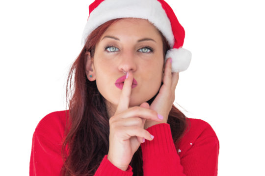A woman wearing a festive red sweater and a Santa hat, holding a finger to her lips, cut out
