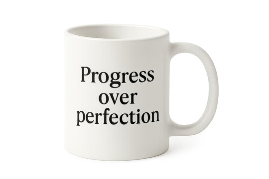 White mug showing progress over perfection quote
