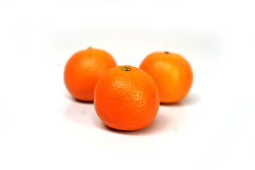 Ripe Orange Fruits on Clean White Surface.