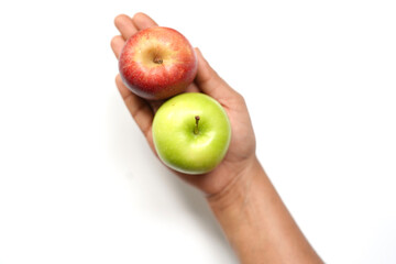 Red and Green apples in hand on a white background.