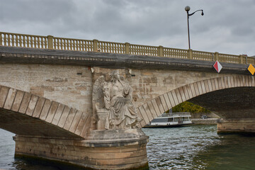 Victory of the Earth sculpture by Victor Vilain on the Pont des Invalides in Paris with a mythological relief in stone