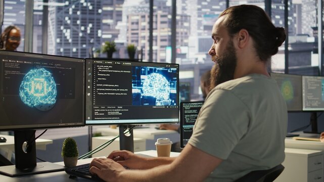 Software technician using computer for artificial intelligence computing simulating human brain. Close up of employee working with AI deep neural networks on desktop PC, camera B