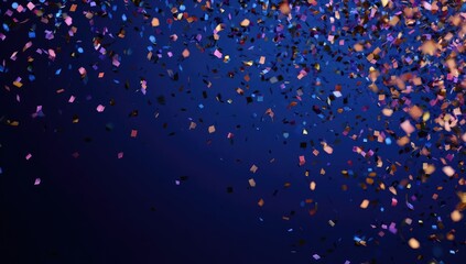 Colorful confetti falling on a deep blue background