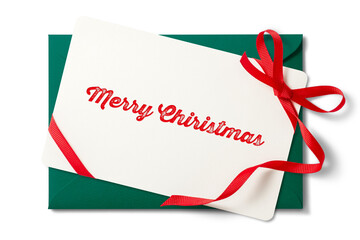 リボンを結んだクリスマスカードと緑色の封筒