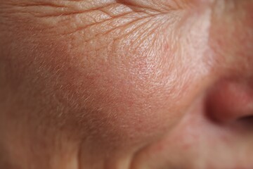 Naklejka premium macro of slightly sagging skin texture, middle-age woman,