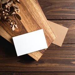 A rustic wooden table adorned with scattered pieces of raw wood and sheets of textured paper, creating an inviting, creative workspace atmosphere.