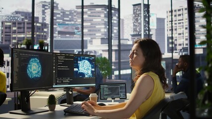 Admin developing artificial intelligence machine learning APIs solving complex problems. Woman training AI predictive models capable of handling resource intensive tasks, camera B