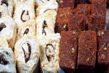 Several types of fruit and coconut Turkish delight at the market. Gluten-free oriental sweets. Lactose-free. Market. High in calories.