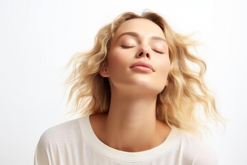 Naklejka premium Beautiful model posing with closed eyes and waving hair for beauty campaign