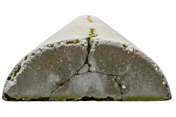Weathered and cracked concrete parking bollard with moss growing isolated on transparent background