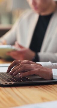 Hands, laptop and business person typing in office for accounting, audit or review. Woman, coworking and accountant with computer in workplace for budget report, bookkeeping and financial planning