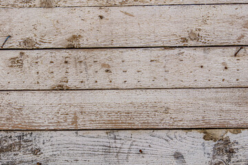 Naklejka premium Detailed close up of rustic wooden planks with natural grain, rough texture, scratches, and weathered surface. Perfect background for design projects, vintage decor, carpentry, and creative artwork.