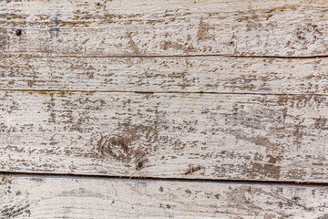 Fototapeta premium Detailed close up of rustic wooden planks with natural grain, rough texture, scratches, and weathered surface. Perfect background for design projects, vintage decor, carpentry, and creative artwork.