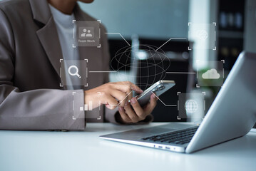 Businessman uses a tablet to analyze data on a virtual interface, symbolizing business innovation, technology, and global connection