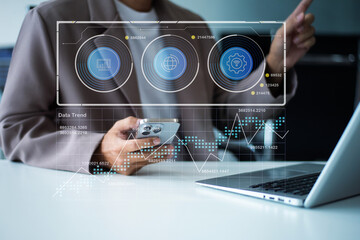Closeup of smartphone user planning with a futuristic dashboard UI, featuring data visualization, calendar interface in office