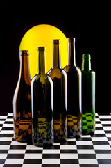 Still life with glass objects on a black background