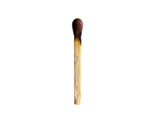 A single, partially burned wooden stick match against a stark, black backdrop
