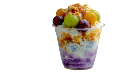 Colorful Filipino halo-halo dessert served in a glass, layered with shaved ice, fruits, jelly, ube, and leche flan topping