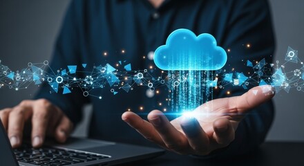 Male hand holding digital cloud with network symbols and binary code displayed above open laptop