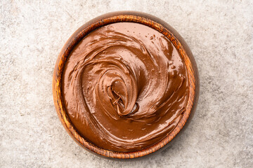 Cream chocolate in a bowl on a vintage background
