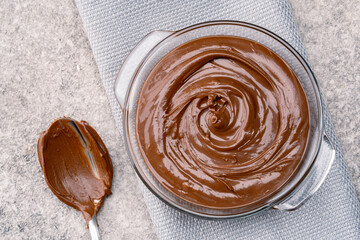 Cream chocolate in a bowl on a vintage background
