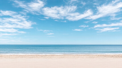Obraz premium Serene beach scene with soft sand, calm ocean waves, and clear blue sky