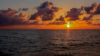 A beautiful sunset at sea. Landscape of a red sunset at sea.