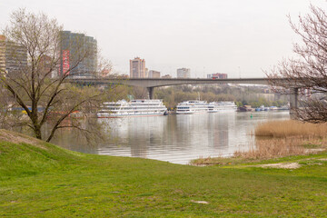 A view of the automobile bridge across the Don River in the metropolis. Urban coastal landscape along the Don River