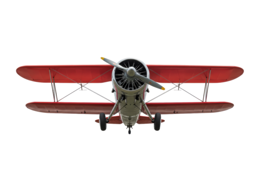 Isolated low-angle view of a red biplane with a propeller, flying overhead, from below