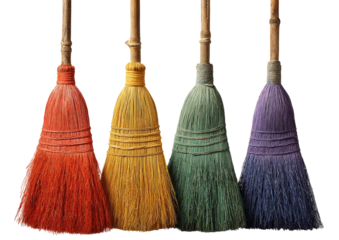 Four colorful, upright brooms, each a different shade, on a transparent background