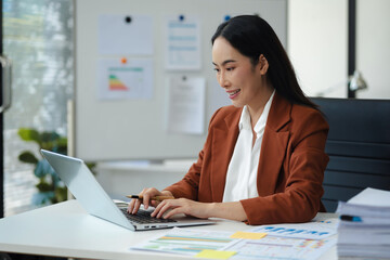 Women are sitting searching for information at home office.