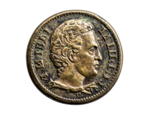 Antique bronze coin showing a profile of a man with laurel leaves around him