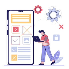 Young man working on mobile app design with laptop and tools  