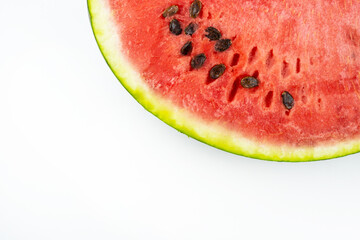 Red sliced watermelon. Close-up of watermelon slices against a white background.