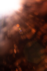Blurred image Sun flare on the black background