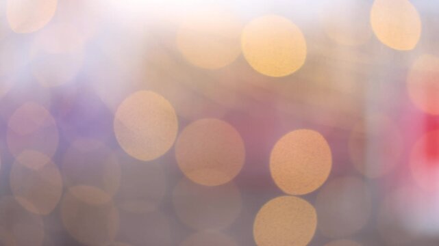 Christmas background festival background with shining golden glitter glowing bokeh particle. Defocused decoration ornaments ball and defused garland lights on classic decorated Christmas tree