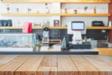 Close-up of a wooden table surface with blurred coffee shop background, perfect for product display, advertisement, or cafe design mockups.