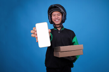 Happy Indonesian Delivery Man in Uniform and Helmet Presents Phone and Brown Cardboard Boxes Blue...