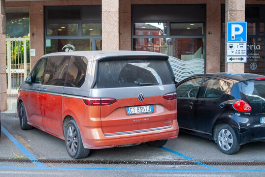 Volkswagen Multivan T7 parked on street in Italy, modern multipurpose van in urban setting